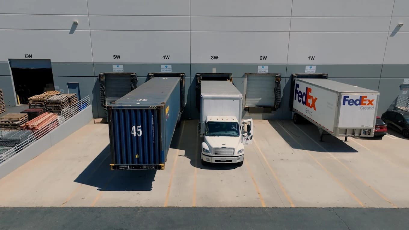Loading docks with carrier trailers staged for outbound shipments